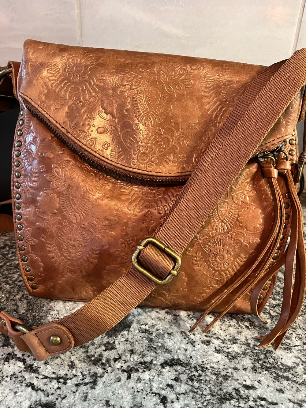 The Sak Crossbody Bag Silverlake Leather Stamped Embossed Brown Floral Rivets